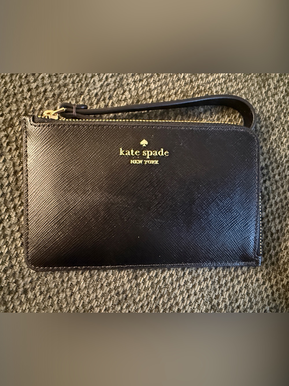 kate spade black leather wristlet with gold logo